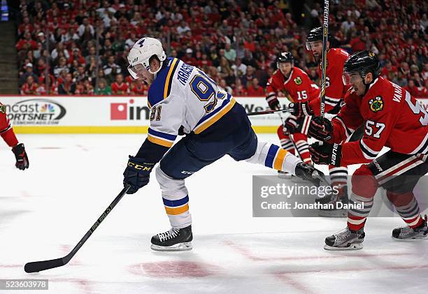 Vladimir Tarasenko of the St. Louis Blues controls the puck in front of Artem Anisimov, Andrew Ladd and Trevor van Riemsdyk of the Chicago Blackhawks...