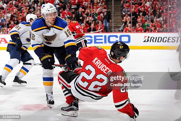 Jori Lehtera of the St. Louis Blues pushes into Marcus Kruger of the Chicago Blackhawks in the third period of Game Six of the Western Conference...