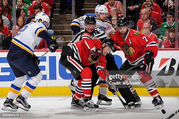 Artem Anisimov of the Chicago Blackhawks works to get the puck in front of linesman Derek Nansen in the first period of Game Six of the Western...