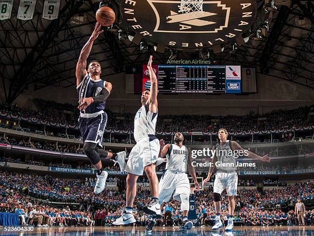 Russell Westbrook of the Oklahoma City Thunder goes in for the layup against the Dallas Mavericks in Game Four of the Western Conference...