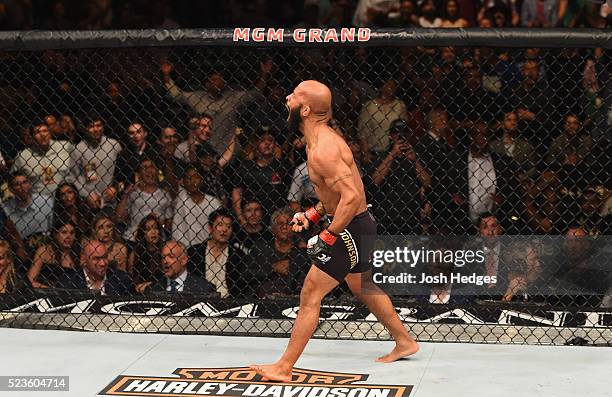 Demetrious Johnson celebrates his TKO victory over Henry Cejudo in their flyweight championship bout during the UFC 197 event inside MGM Grand Garden...