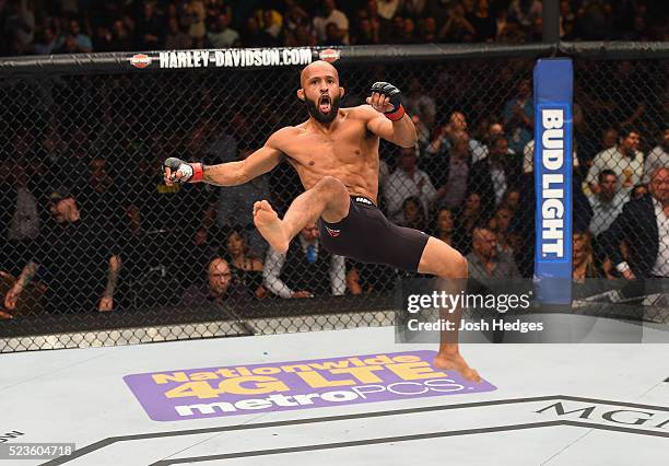 Demetrious Johnson celebrates his TKO victory over Henry Cejudo in their flyweight championship bout during the UFC 197 event inside MGM Grand Garden...