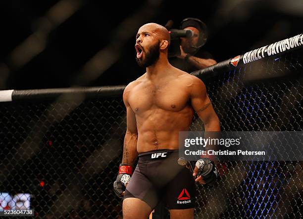 Demetrious Johnson celebrates his TKO victory over Henry Cejudo in their flyweight championship bout during the UFC 197 event inside MGM Grand Garden...