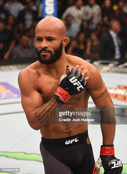 Demetrious Johnson celebrates his TKO victory over Henry Cejudo in their flyweight championship bout during the UFC 197 event inside MGM Grand Garden...