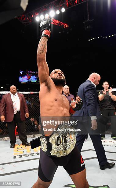 Demetrious Johnson celebrates his TKO victory over Henry Cejudo in their flyweight championship bout during the UFC 197 event inside MGM Grand Garden...