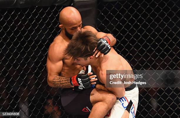 Demetrious Johnson knees Henry Cejudo in their flyweight championship bout during the UFC 197 event inside MGM Grand Garden Arena on April 23, 2016...
