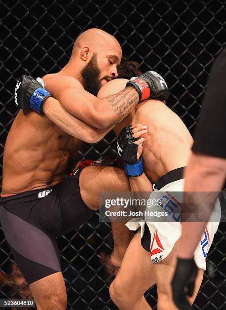 Demetrious Johnson knees Henry Cejudo in their flyweight championship bout during the UFC 197 event inside MGM Grand Garden Arena on April 23, 2016...