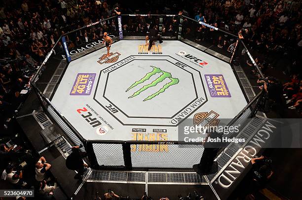 An overhead view as Demetrious Johnson celebrates his victory over Henry Cejudo in their flyweight championship bout during the UFC 197 event inside...