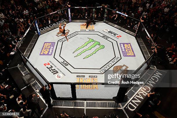 An overhead view as Demetrious Johnson celebrates his victory over Henry Cejudo in their flyweight championship bout during the UFC 197 event inside...