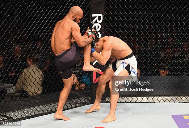 Demetrious Johnson knees Henry Cejudo in their flyweight championship bout during the UFC 197 event inside MGM Grand Garden Arena on April 23, 2016...