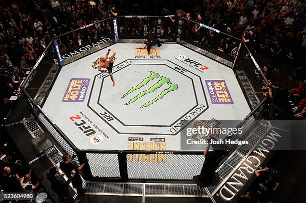 An overhead view as Demetrious Johnson celebrates his victory over Henry Cejudo in their flyweight championship bout during the UFC 197 event inside...