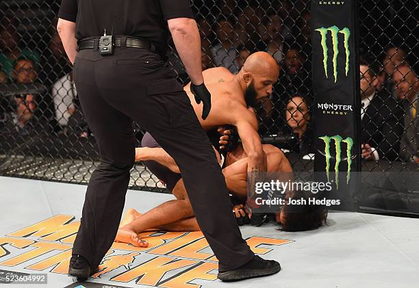 Demetrious Johnson punches Henry Cejudo in their flyweight championship bout during the UFC 197 event inside MGM Grand Garden Arena on April 23, 2016...