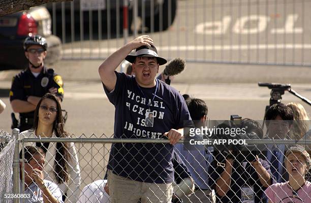 Fans gathered outside the Santa Barbara County Superior Court on March 10, 2005 in Santa Maria, California, as pop star Michael Jackson arrives late...