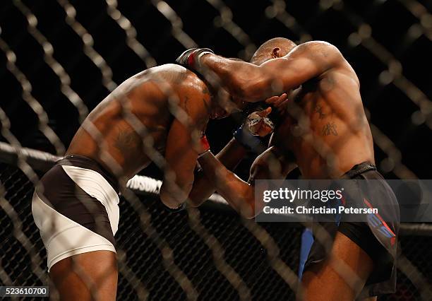 Jon Jones uppercuts Ovince Saint Preux in their interim UFC light heavyweight championship bout during the UFC 197 event inside MGM Grand Garden...