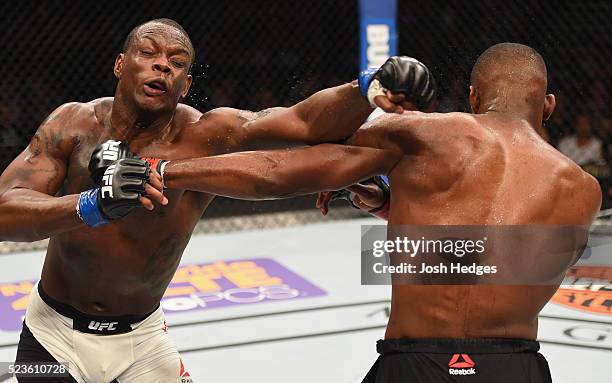 Ovince Saint Preux exchange punches with Jon Jones in their interim UFC light heavyweight championship bout during the UFC 197 event inside MGM Grand...