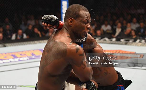 Jon Jones punches Ovince Saint Preux in their interim UFC light heavyweight championship bout during the UFC 197 event inside MGM Grand Garden Arena...