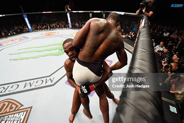 Jon Jones picks up Ovince Saint Preux in their interim UFC light heavyweight championship bout during the UFC 197 event inside MGM Grand Garden Arena...