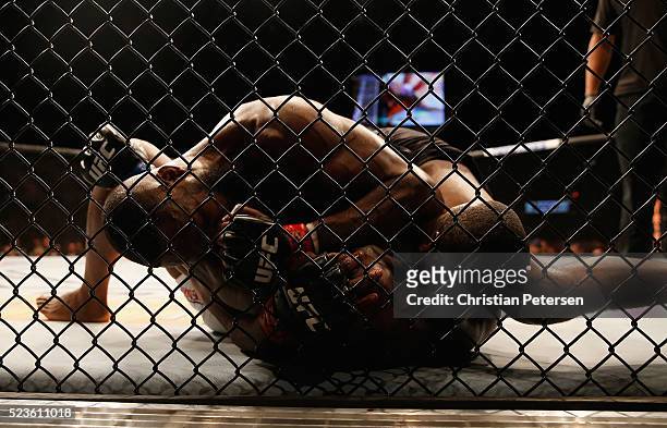 Jon Jones elbows Ovince Saint Preux in their interim UFC light heavyweight championship bout during the UFC 197 event inside MGM Grand Garden Arena...