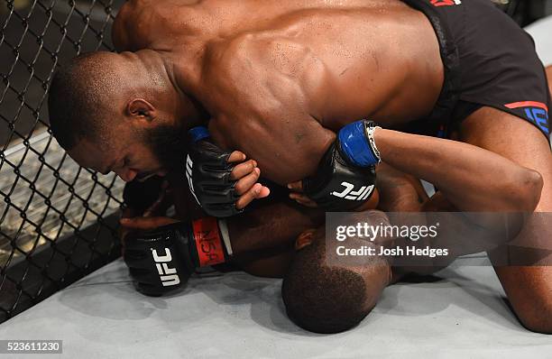 Jon Jones elbows Ovince Saint Preux in their interim UFC light heavyweight championship bout during the UFC 197 event inside MGM Grand Garden Arena...