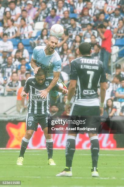 Emanuel Villa of Queretaro heads the ball over Walter Gargano of Monterrey during the 15th round match between Monterrey and Queretaro as part of the...