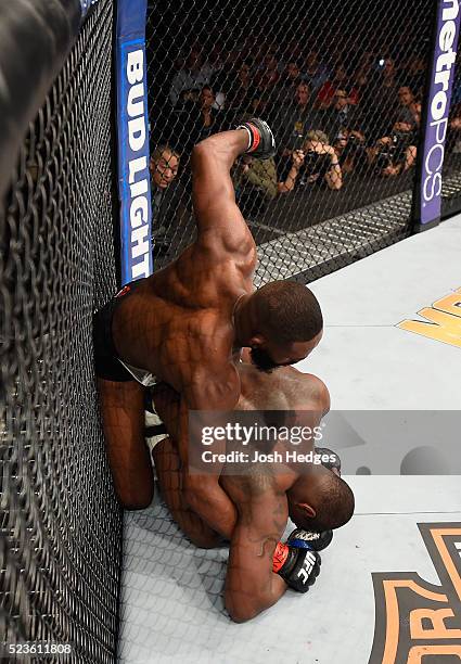 Jon Jones punches Ovince Saint Preux in their interim UFC light heavyweight championship bout during the UFC 197 event inside MGM Grand Garden Arena...