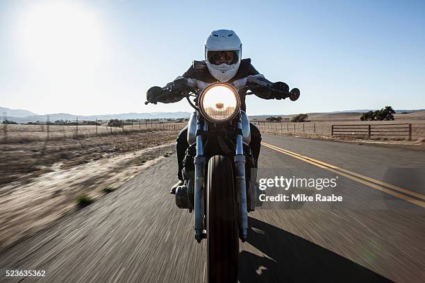 man riding motorcycle on country roads, santa barbara county, california, usa - motocicletta foto e immagini stock