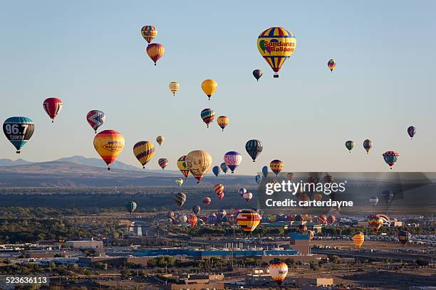 hot air balloons at sunrise albuquerque new mexico - hot air balloon festival stock pictures, royalty-free photos & images