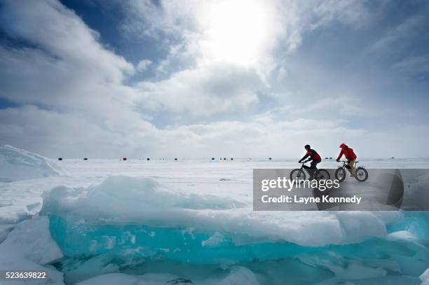 fat tire biking on lake superior - lake superior winter stock pictures, royalty-free photos & images