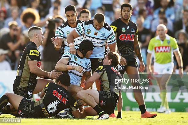 Michael Ennis of the Sharks celebrates scoring a try during the round eight NRL match between the Cronulla Sharks and the Penrith Panthers at...