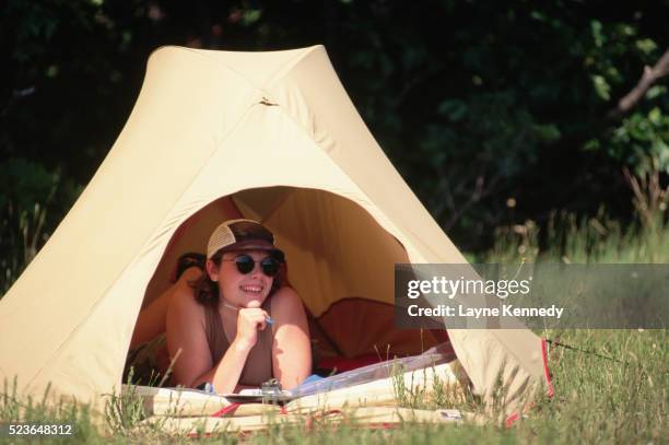 camper inside tent - archival camping stock pictures, royalty-free photos & images