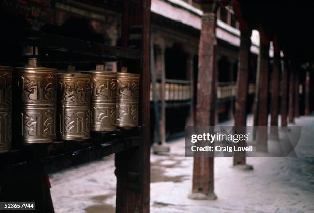 prayer wheels in the jokhang - prayer wheel stock pictures, royalty-free photos & images