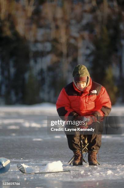 ice fishing on loon lake - boundary waters canoe area stock pictures, royalty-free photos & images