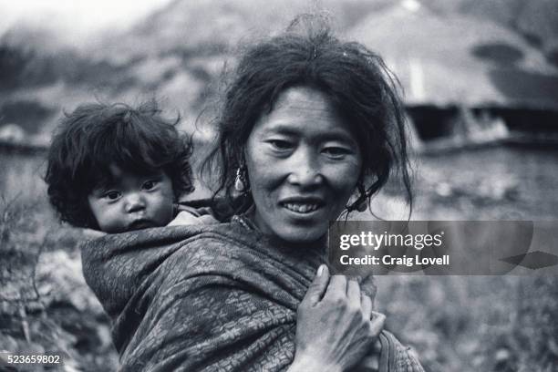 nepali mother with infant son - nepali mother stock pictures, royalty-free photos & images