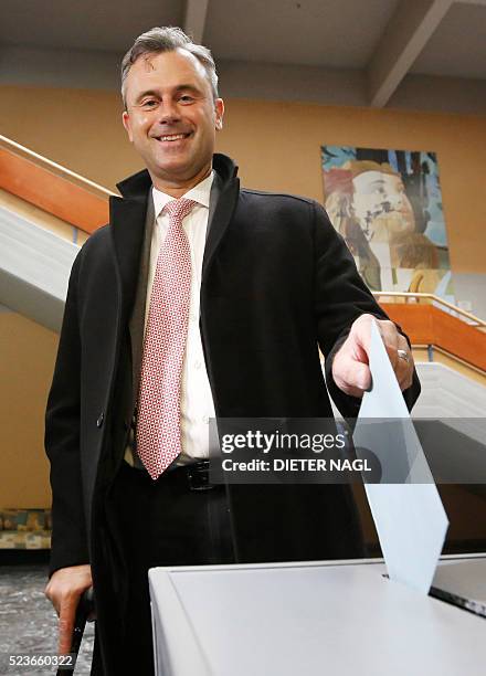 The candidat of the far-right Freedom Party Norbert Hofer drops his ballot at the polling station at the first round of Austrian President elections...