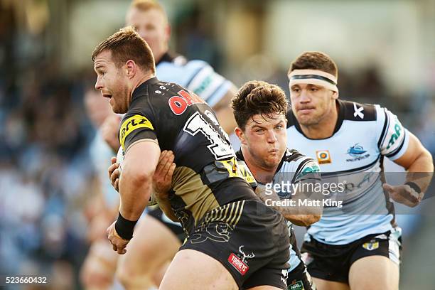 Trent Merrin of the Panthers is tackled during the round eight NRL match between the Cronulla Sharks and the Penrith Panthers at Southern Cross Group...