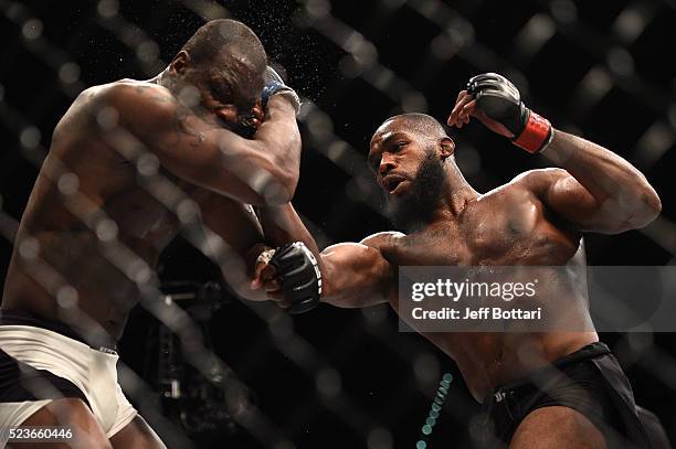 Jon Jones punches Ovince Saint Preux in their interim UFC light heavyweight championship bout during the UFC 197 event inside MGM Grand Garden Arena...