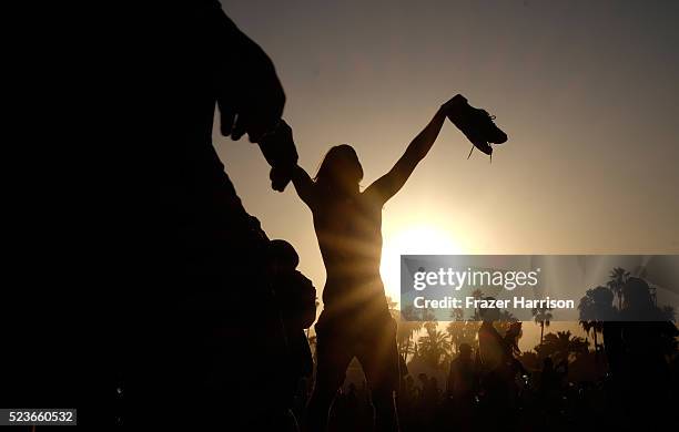 Music fans are seen during sunset at day 2 of the 2016 Coachella Valley Music & Arts Festival Weekend 2 at the Empire Polo Club on April 23, 2016 in...