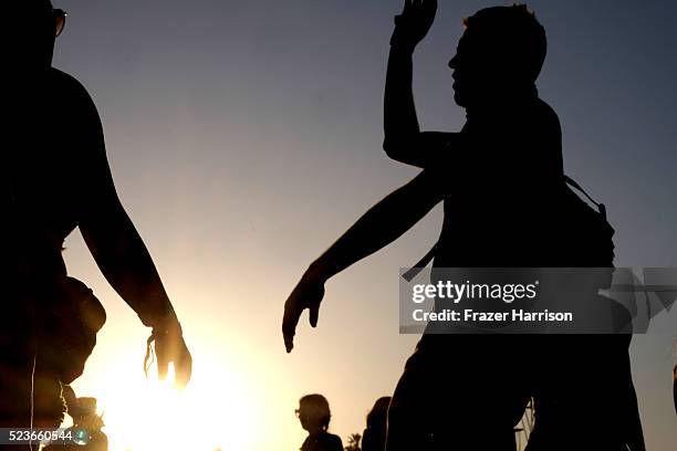 Music fans are seen during sunset at day 2 of the 2016 Coachella Valley Music & Arts Festival Weekend 2 at the Empire Polo Club on April 23, 2016 in...