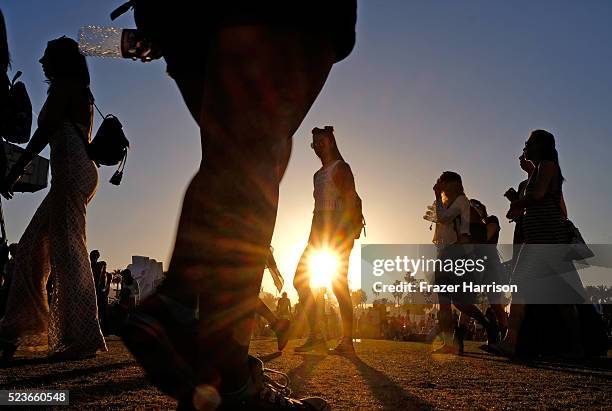 Music fans are seen during sunset at day 2 of the 2016 Coachella Valley Music & Arts Festival Weekend 2 at the Empire Polo Club on April 23, 2016 in...