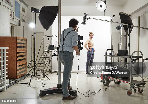 woman posing in photographers' studio - bt stock pictures, royalty-free photos & images