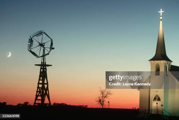 church and windmill at sunset - church sunset rural scene stock pictures, royalty-free photos & images