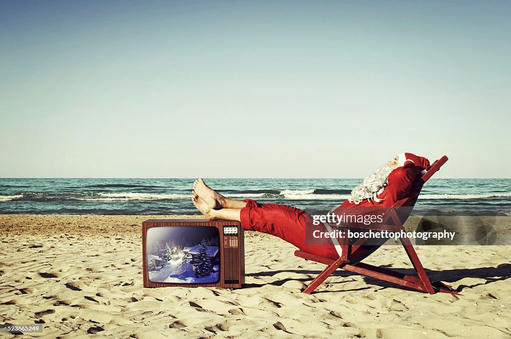 Santa Claus On Vacation, Sunbathing On The Beach