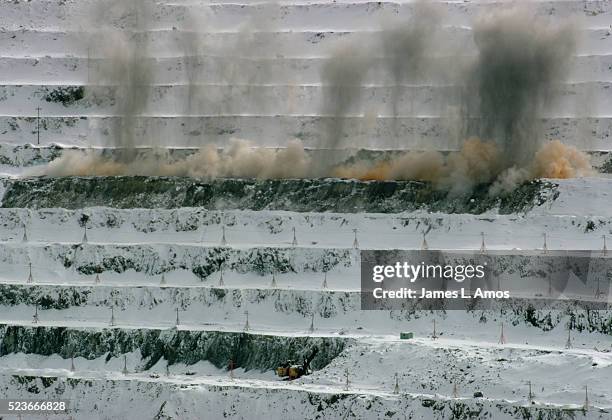 exploding dynamite at bingham canyon copper mine - bingham canyon mine stock pictures, royalty-free photos & images