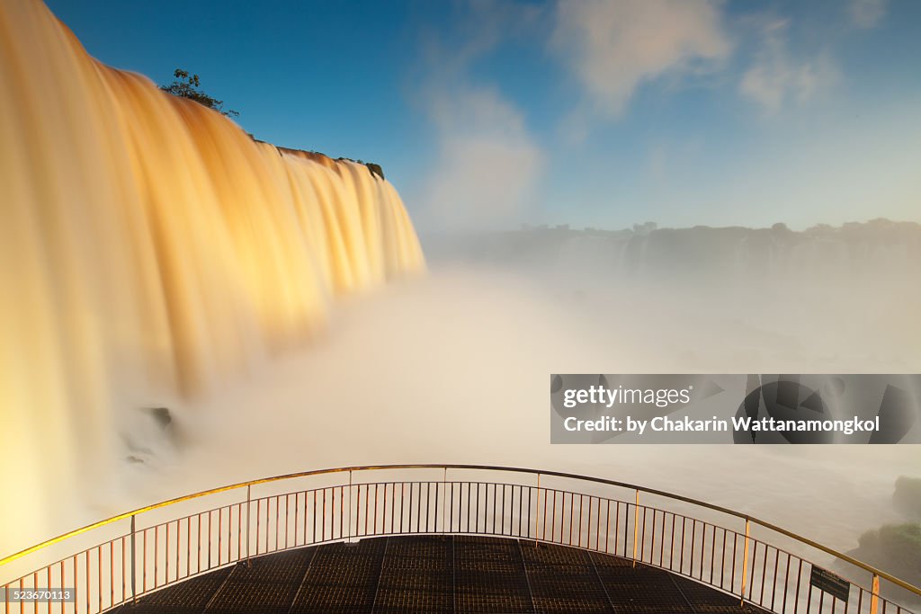 The balcony with golden waterfall (Iguazu)