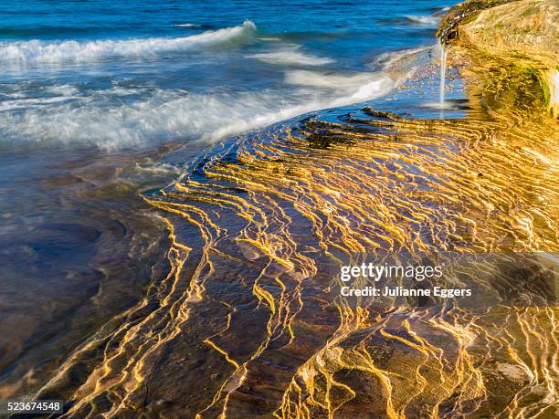 waterfall and sandstone rock, pictured rocks national lakeshore, michigan. - lake superior stock pictures, royalty-free photos & images
