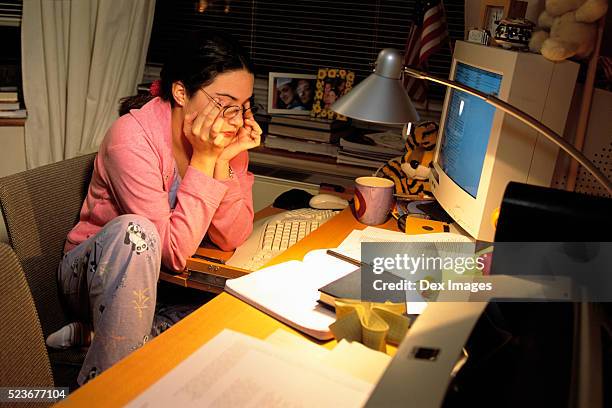 college student studying late at night - mühsal stock-fotos und bilder