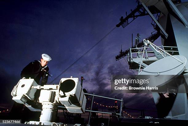 sailor on battleship by aegis defense system - radar stock pictures, royalty-free photos & images