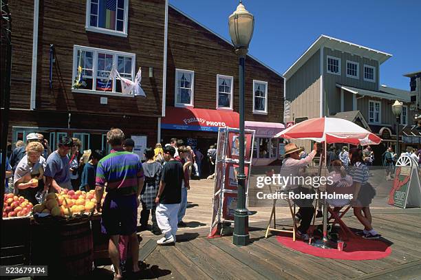 shops and stands on pier 39 - fishermans wharf stock pictures, royalty-free photos & images