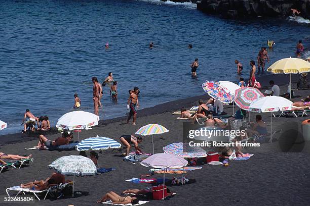 bathers at arena beach - arena playa stock-fotos und bilder