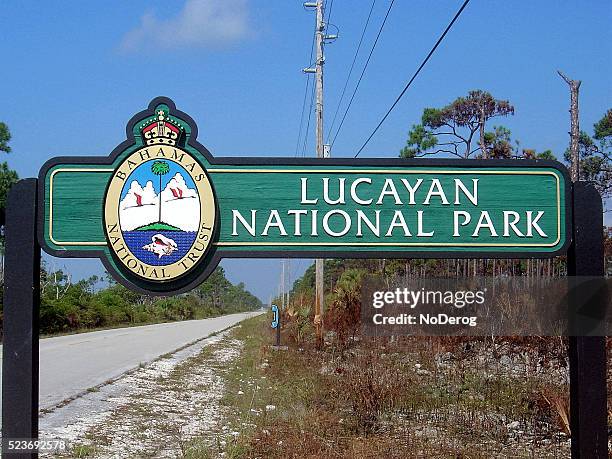 lucayan national park sign on grand bahama island - grand bahama stock pictures, royalty-free photos & images